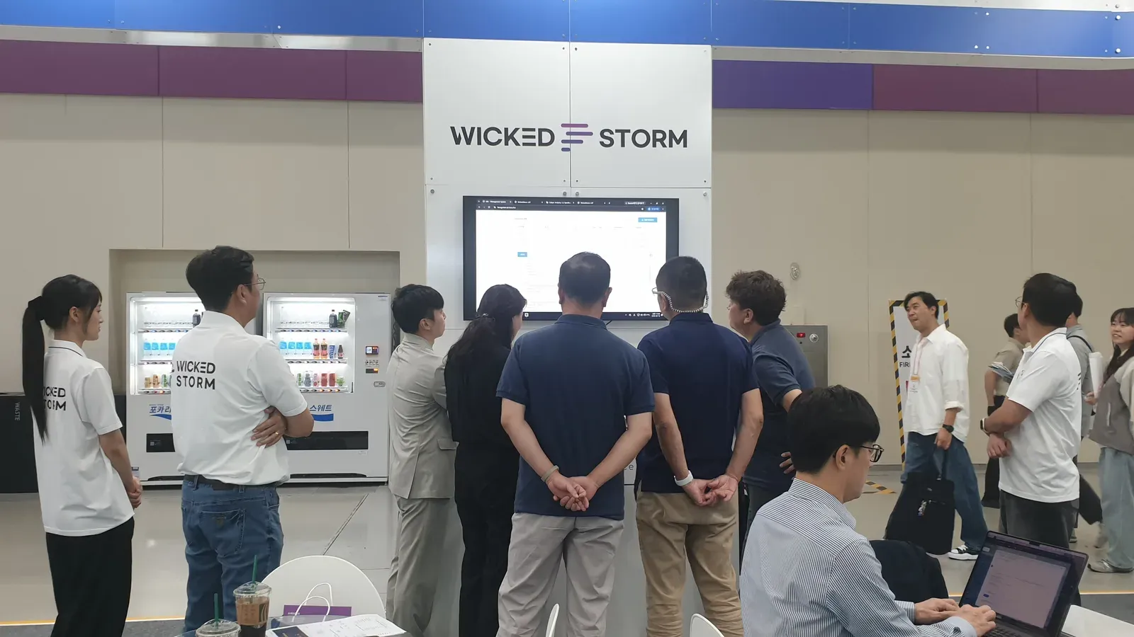 Visitors gathered in front of the demo screens at the Wicked Storm booth, EdTech Korea Fair 2026